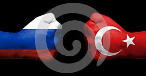Concept of relations between Russia and Turkey symbolized by two opposed clenched fists