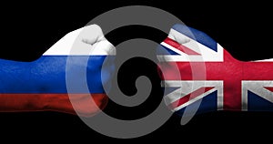 Concept of relations between Russia and the United Kingdom symbolized by two opposed clenched fists