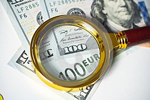 The concept of research and search for investments and capitals. Business market. Magnifying glass on money.