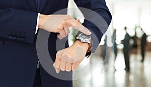 Concept of respect for time. businessman pointing his finger at