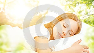 concept of rest and relaxation. woman sleeping in bed on the background of nature photo