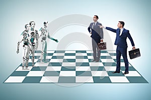 Concept of rivalry between robots and humans photo