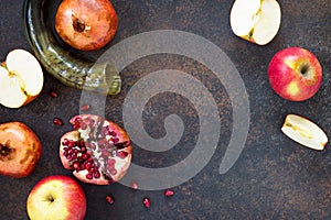 The concept of Rosh hashanah Jewish New Year. Traditional holiday symbols - shofar, apple and pomegranate