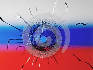 The concept of Russian aggression. Bullet hole on defocused background