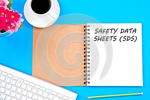 Concept SAFETY DATA SHEETS SDS message with modern workplace o photo