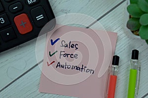 Concept of Sales Force Automation write on sticky notes isolated on Wooden Table