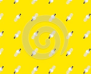 The concept of saving energy. seamless pattern of fluorescent lamps on a yellow