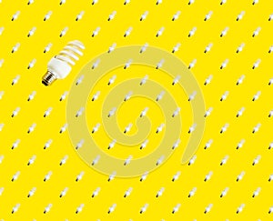 The concept of saving energy. seamless pattern of fluorescent lamps on a yellow