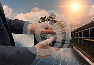 Concept of saving money if using solar energy