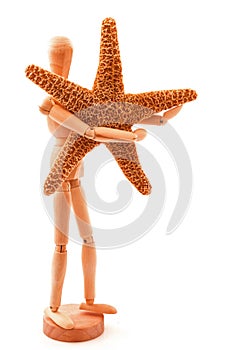 Concept with sea star, seastar and wooden toy. Isolated on white background