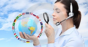 Concept search, woman with headset, globe, flags and magnifying