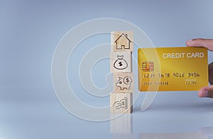 Concept of selling a house. A hand is holding credit card on a white background. Real estate agent offer house, property insurance