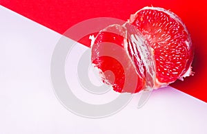 Concept sex, masturbation. Grapefruit, vagina symbol on a pink background photo