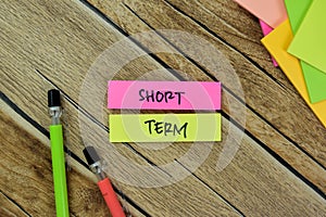 Concept of Short Term write on sticky notes isolated on Wooden Table