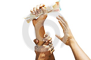 Concept showing of Greed for money, Hands trying to grab money from another person hands photo