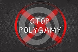 Concept of showing STOP POLYGAMY with red cross mark over STOP POLYGAMY text on black board