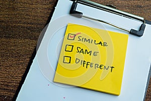 Concept of Similar, Same, Different write on sticky notes isolated on Wooden Table