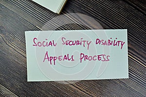 Concept of Social Security Disability Appeals Process write on sticky notes isolated on Wooden Table