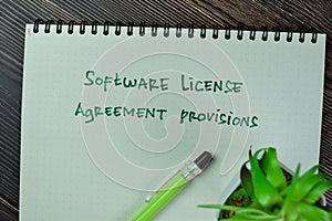 Concept of Software License Agreement Provisions write on a book isolated on Wooden Table