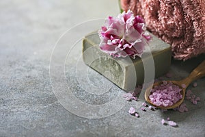 The concept spa. Handmade soap, towels, flowers and sea salt.