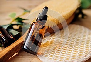 The concept of spa treatment. Natural, organic cosmetics with eucalyptus oil, massage brush, eucalyptus leaf extract