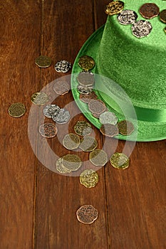 Concept of St. Patrick. Green hat and lucky coins