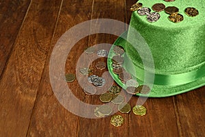 Concept of St. Patrick. Lucky coins and green hat.