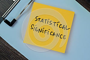 Concept of Statistical Significance write on sticky notes isolated on Wooden Table