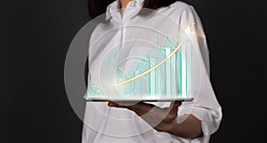 Concept stock market exchanges. woman hand holding digital tablet and showing financial graph.