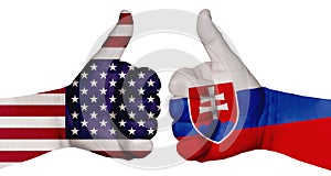 Two hands are painted with flags of different countries, with a thumb raised up. Slovakia and the USA