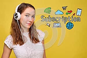 The concept of subscribing to online products, games, music and TV with a girl in headphones with icons photo