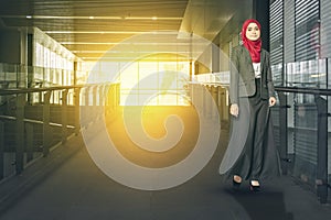 Concept of a successful businesswoman with suit, standing in the