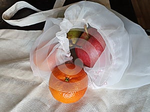 Concept of sustainability - different fruits in a reusable clothe bag