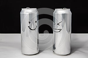 Concept of talking friends. Smile and laugh emoji. dialog of two aluminium cans on black background. Emotions