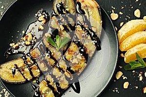 Concept of tasty dessert, grilled banana, close up