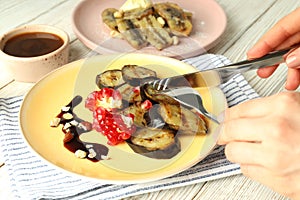 Concept of tasty dessert with grilled banana, close up