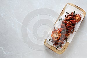 Concept of tasty food - sun-dried tomato, space for text