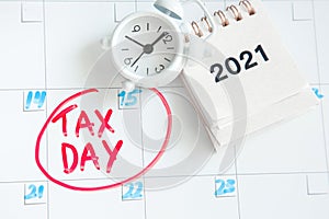concept for Tax day or april 15 , 2021 the national deadline for filing taxes. inscription on the calendar board