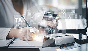 Concept of tax payment optimisation business finance,Man using calculator and taxes icon on technology screen,income tax and prope