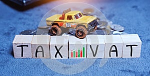 Concept of taxes for car on block cubes paid by individuals and corporations such as VAT, income tax and property tax Data