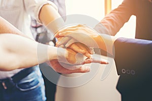 Concept of teamwork: Close-Up of hands business team showing un