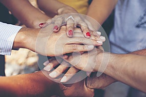 Concept of teamwork: Close-Up of hands business team showing unity with putting their hands together