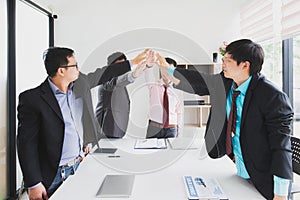 Concept of teamwork: Close-Up of hands business team showing unity with putting their hands together