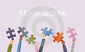 Concept of teamwork and integration with businessman holding colorful puzzle