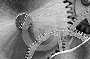 Concept Teamwork or successful business design. Black and white photo background  of old metal gears or parts.