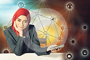 Portrait of Asian business woman using mobile phone over abstract double exposure background