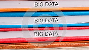 The concept of technology and development. Phrase, words, text BIG DATA close-up on the ends of the notebooks