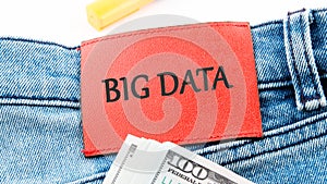 The concept of technology and development. Phrase, words, text BIG DATA on the leather label of jeans