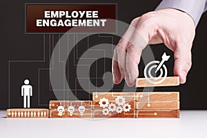 The concept of technology, the Internet and the network. Businessman shows a working model of business: Employee engagement
