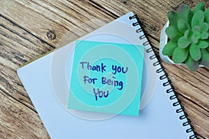 Concept of Thank You For Being You write on sticky notes isolated on Wooden Table